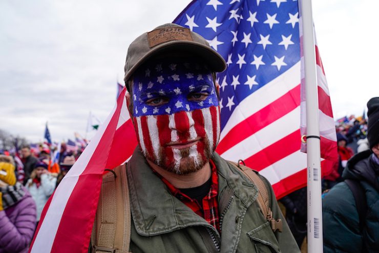 Capital Hill Protestor with American flag painted on his face.